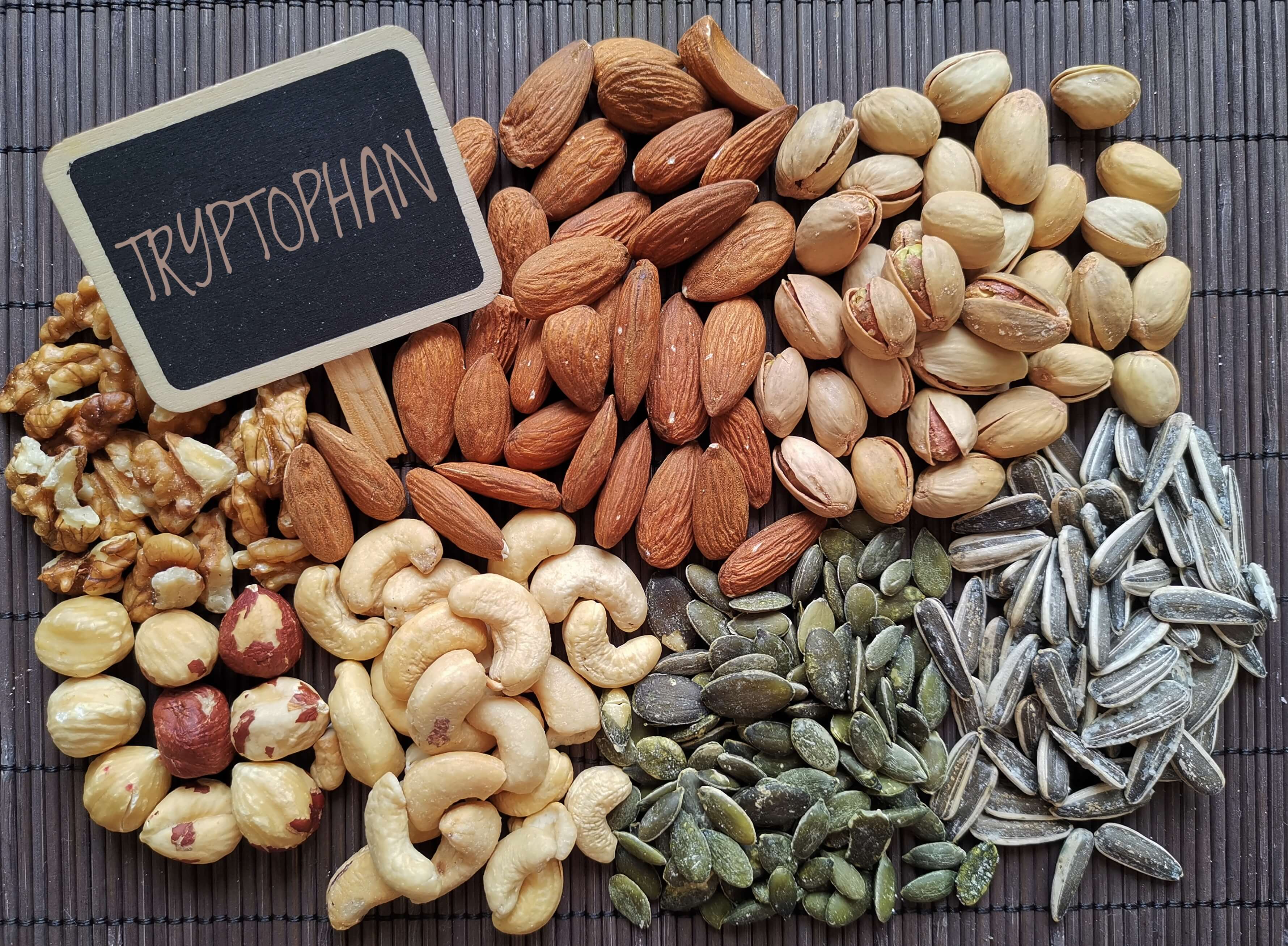 A platter of nuts and seeds which are natural sources of the sleep supplement Tryptophan