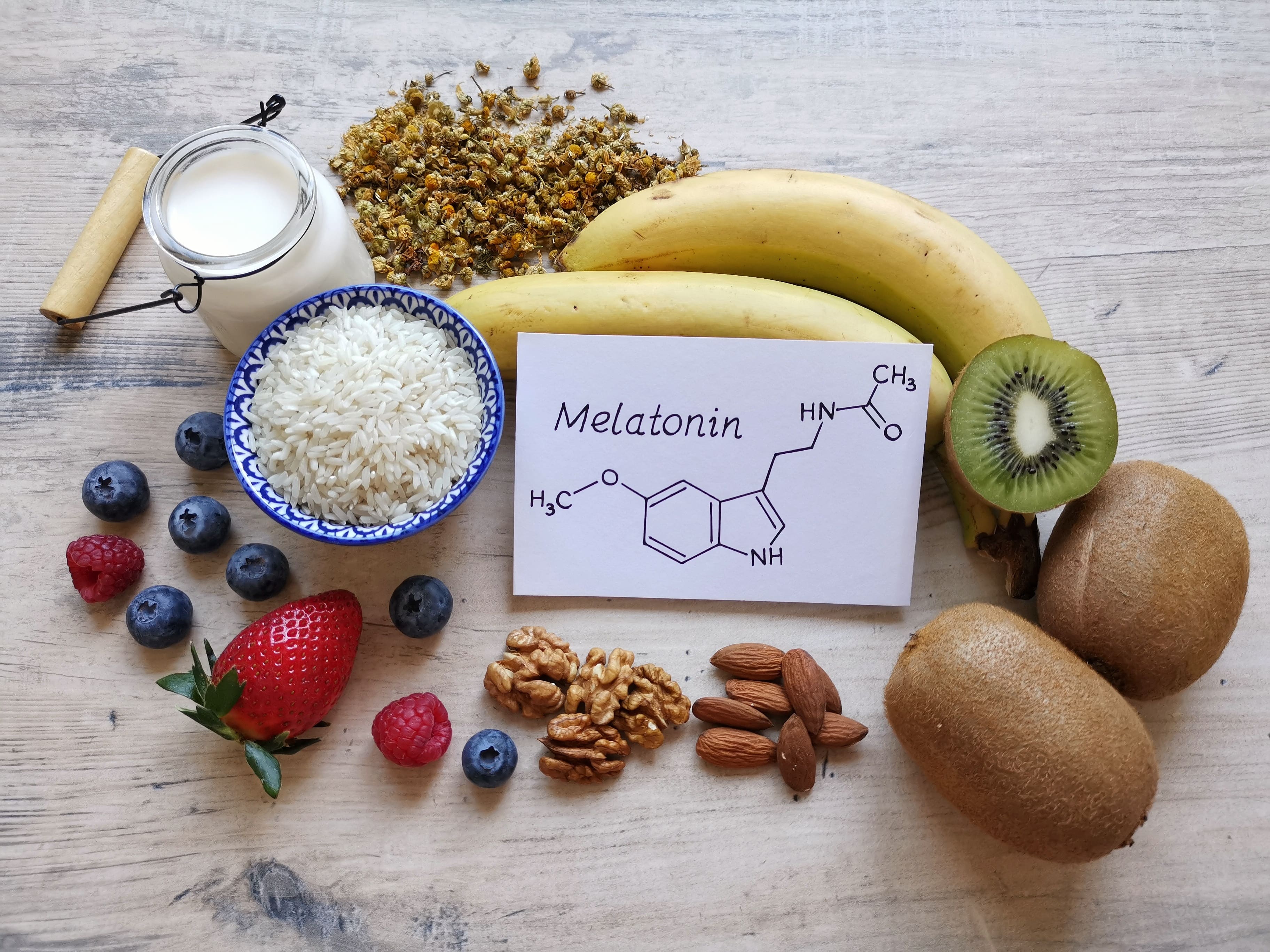 A collection of melatonin-rich foods that could help you sleep including kiwis, bananas, blueberries, strawberries and more