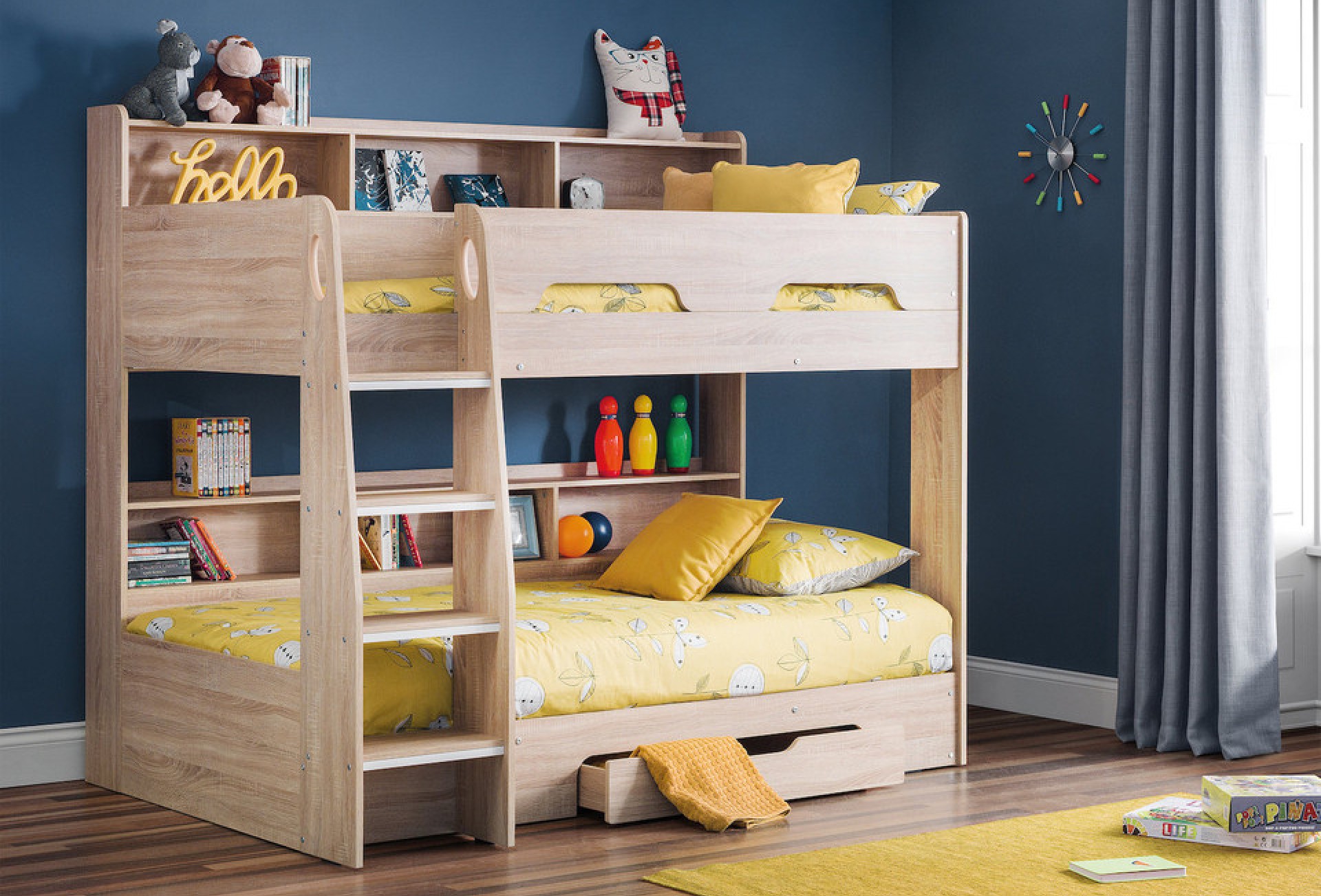 Allegra storage bunkbed for kids set against a deep-blue wall 