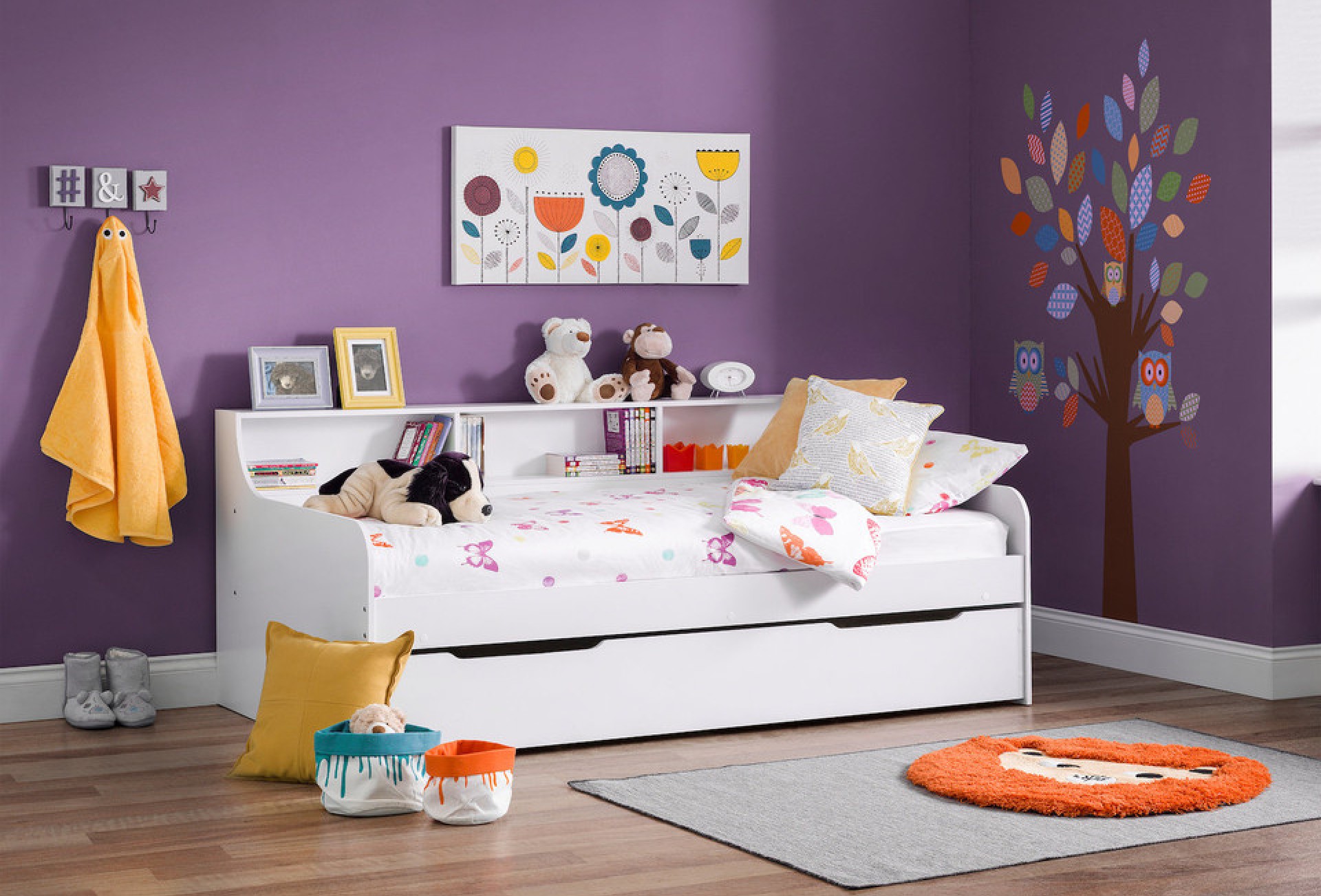 Harlow white day bed set against a purple wall in a nursery, children's bedroom or playroom