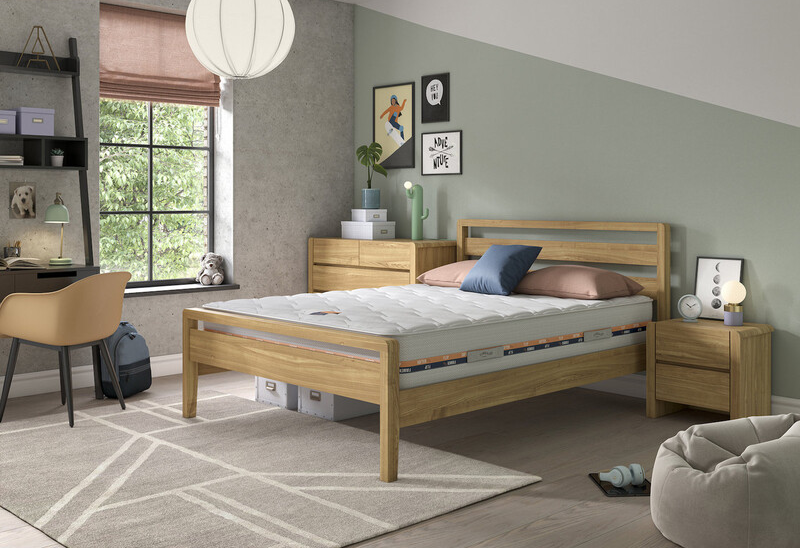 The Simply by Bensons range in light oak situated in an olive green and white bedroom