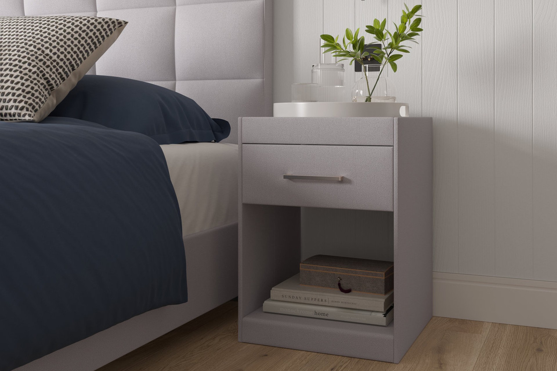 Silvia upholstered grey bedside table with drawer, tempered glass top and and silver handle